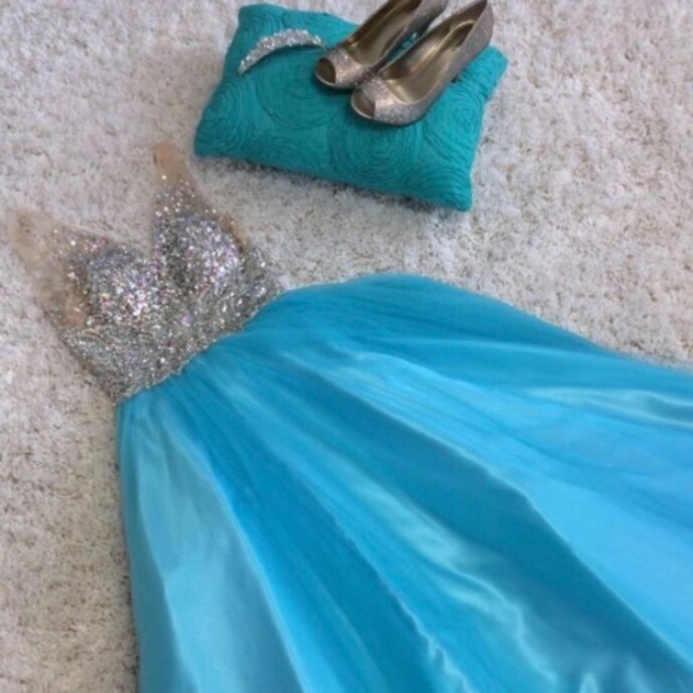 Beautiful jeweled prom dress with a plunging back